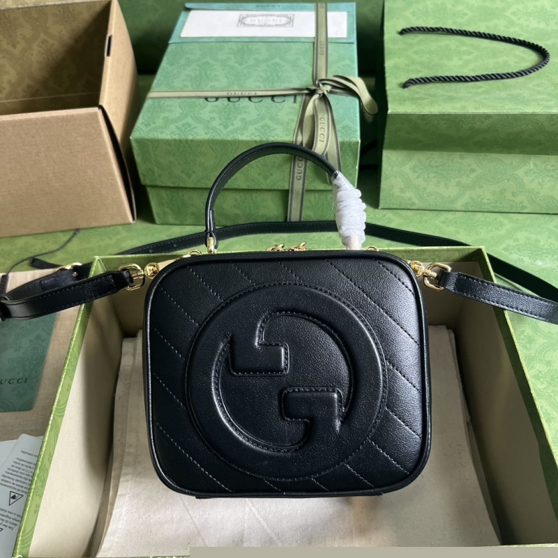 G*u*i top handle bags